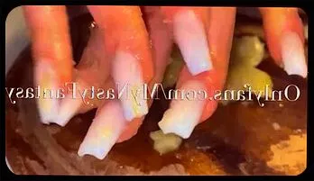Goddess' Long Nails Tease with Banana and Oil