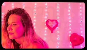 Sensual Blonde Beauty Teases in Romantic Lingerie