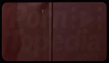 Seductive Redhead in Lingerie Enjoys a Smoky Moment