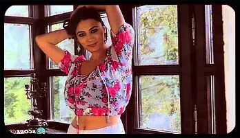 Luna Amor’s Seductive Window Tease: Busty Brunette Pleasures Herself